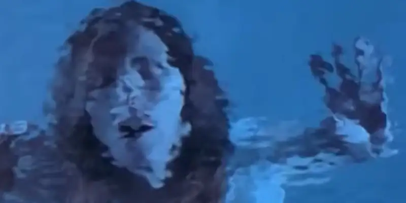 A scene from Female Perversions showing a woman under water