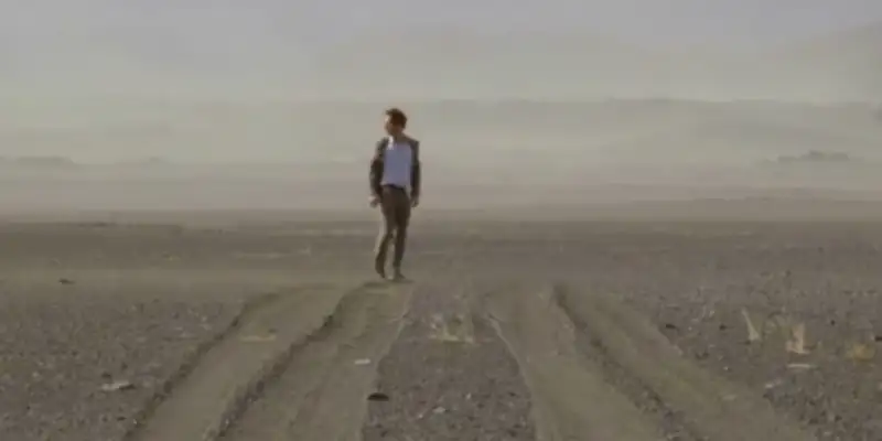 Andreas from The Bothersome Man, standing in a large flat desert alone