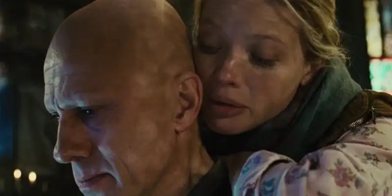 A scene showing Qohen and Bainsley from The Zero Theorem